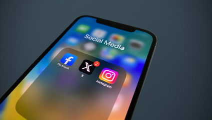 iphone screen showing the facebook, X and instagram apps