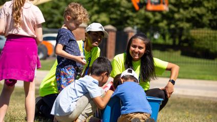A group of people with children in a park