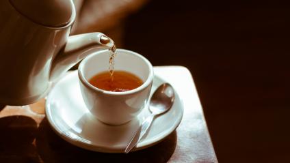 tea being poured into tea cup
