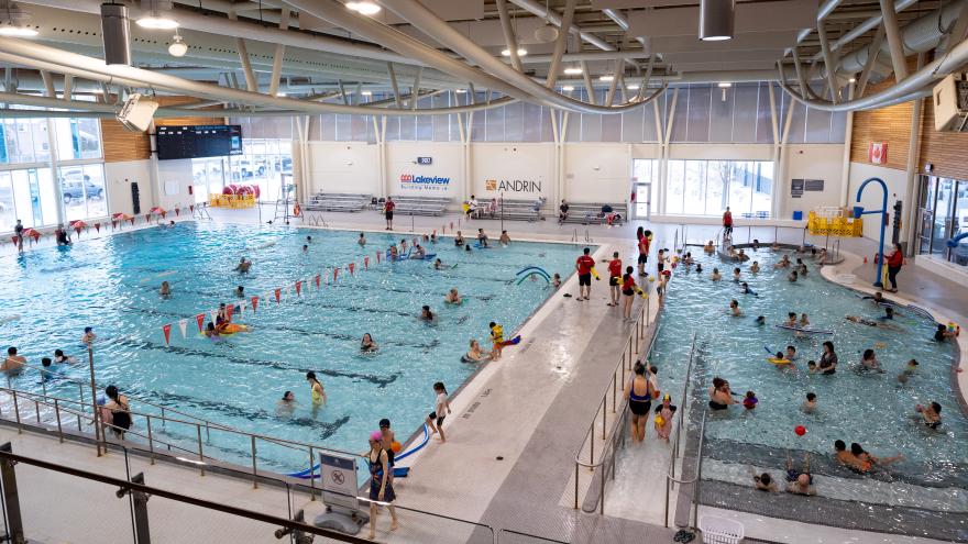 People swimming at an indoor pool