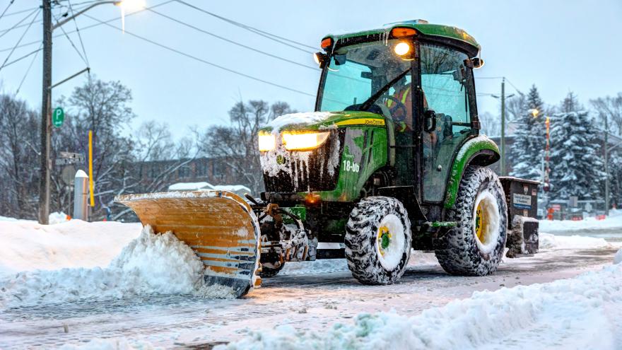 tractor clearing snow from sidewalk