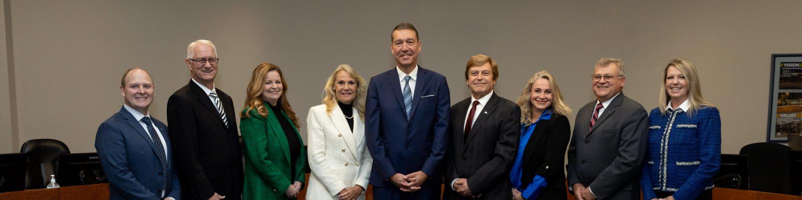 Mayor and members of Council standing in Council chambers