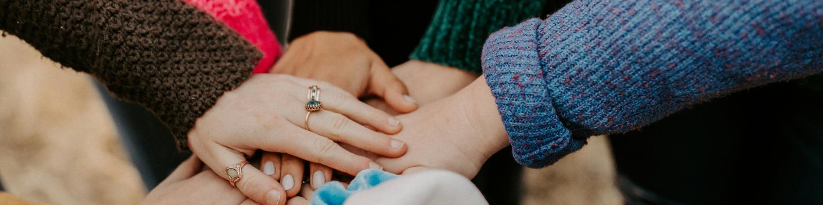 Hands placed on top of each other