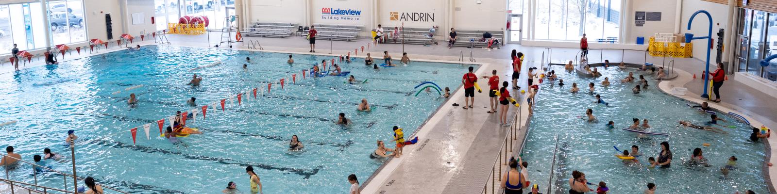 People swimming at an indoor pool