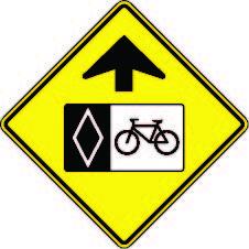 Yield to bikes and carpool lane sign.