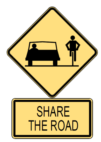 Yellow road sign with car, cyclist, and pedestrian icon; text: "Share the Road."