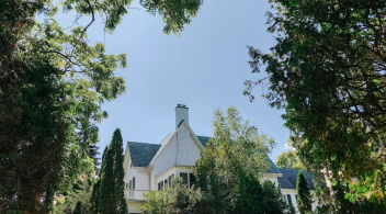 mulock property amidst trees and blue sky