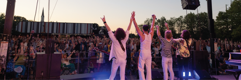 Live music event photo of band on stage and crowd