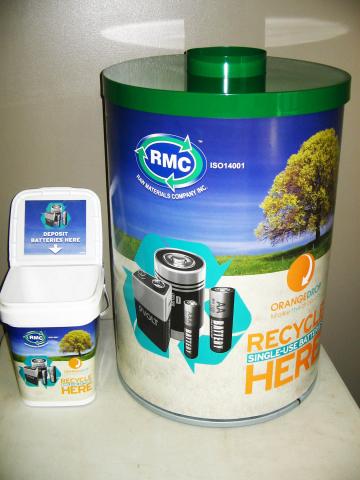 Large and small battery recycling bins with green lids.