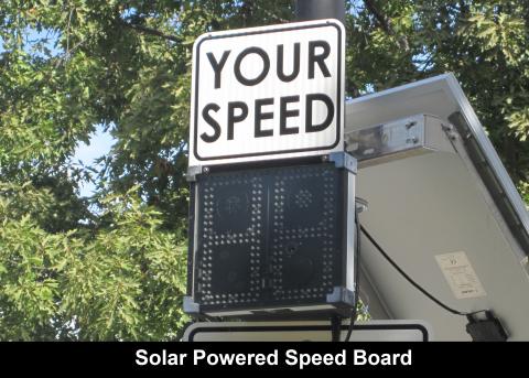 Speed board near trees on a sunny day.