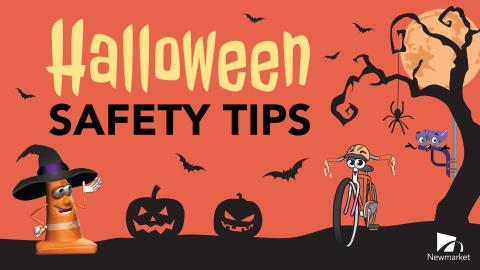 Halloween theme with pumpkins, moon, bats, and a witch hat-wearing cone.