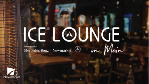 Ice Lounge sign on a window with a blurred street scene at night.