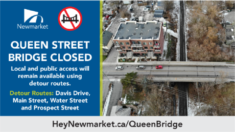 Queen Street Bridge closed sign with detour routes; aerial view of bridge and street below.