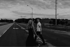 photo of two people crossing a street