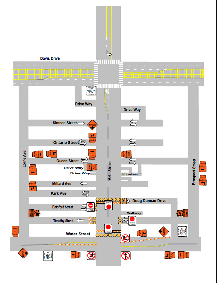 Street map with construction areas and traffic signs marked in orange.