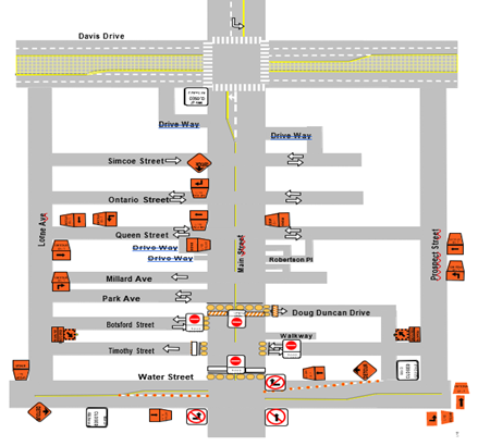 Street map with road names and traffic signs.
