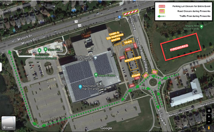 Satellite view of a parking lot and building complex, with colored route markings.