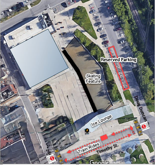 Aerial view of a parking lot and a building.