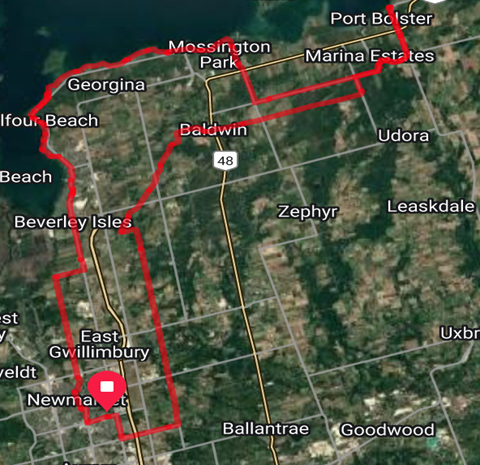 Satellite map with a red outlined route highlighting roads and areas.